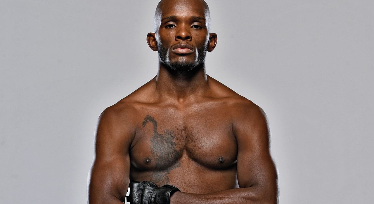 khama worthy with arms folded in ufc attire